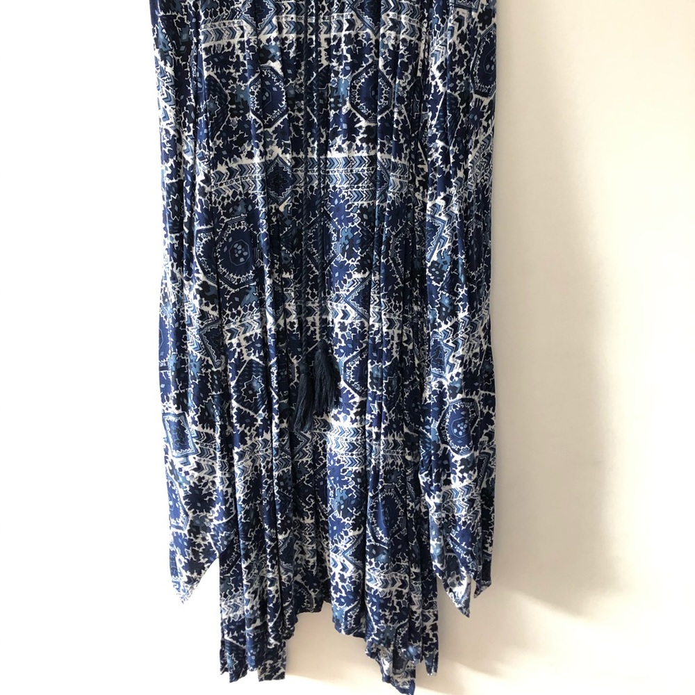 Long Pleated Skirt with Asymmetrical Hem